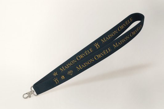A photo of a woven lanyard with logo and print