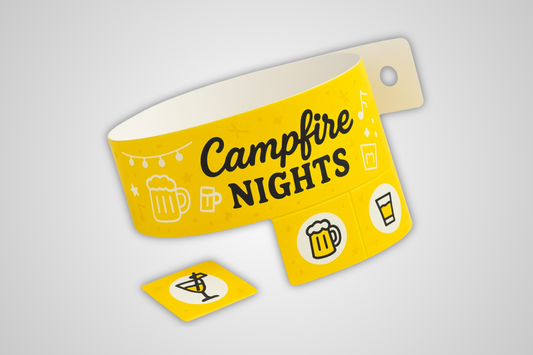 A photo of a yellow entrance wristband with detachable tickets