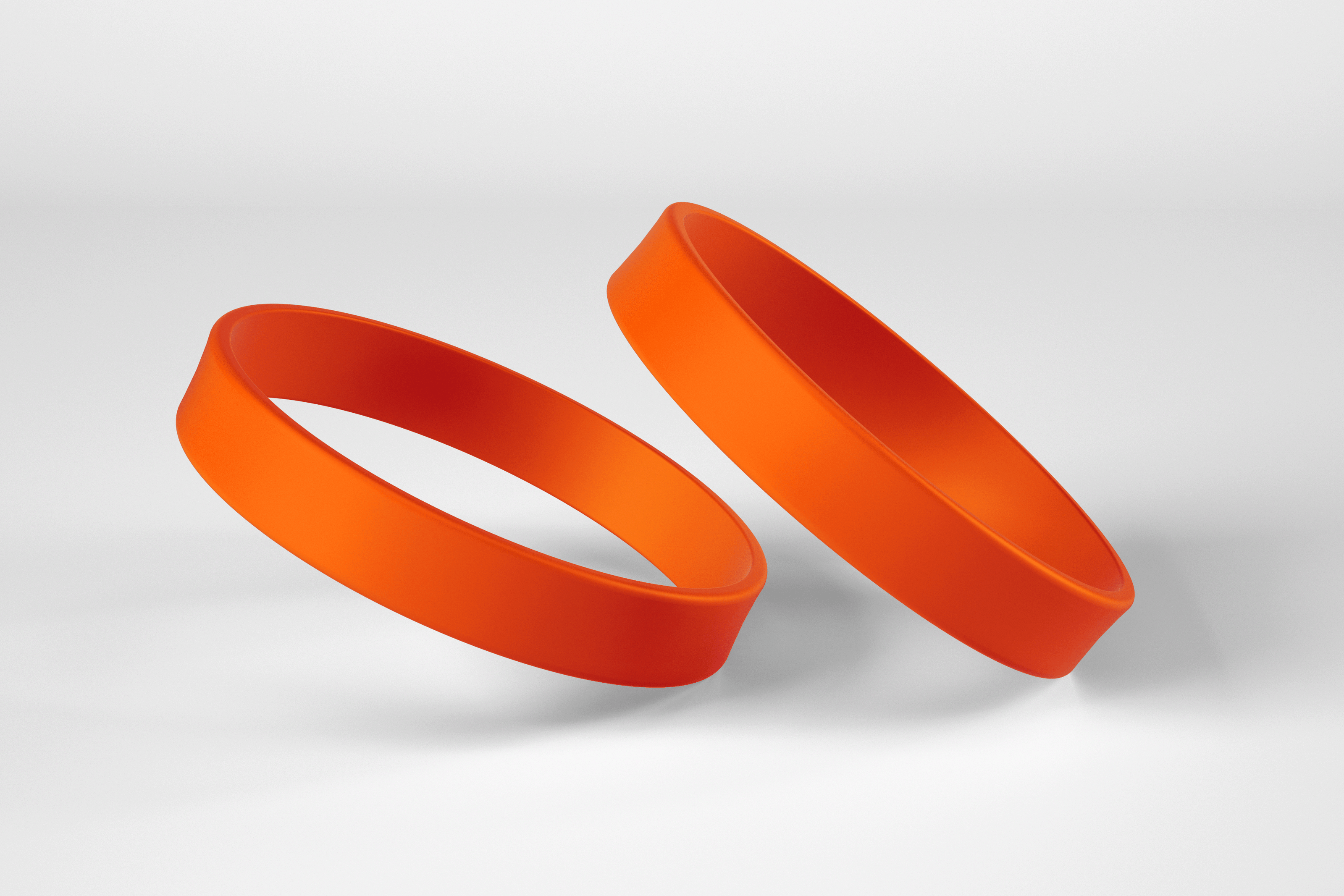 two orange silicone wristbands